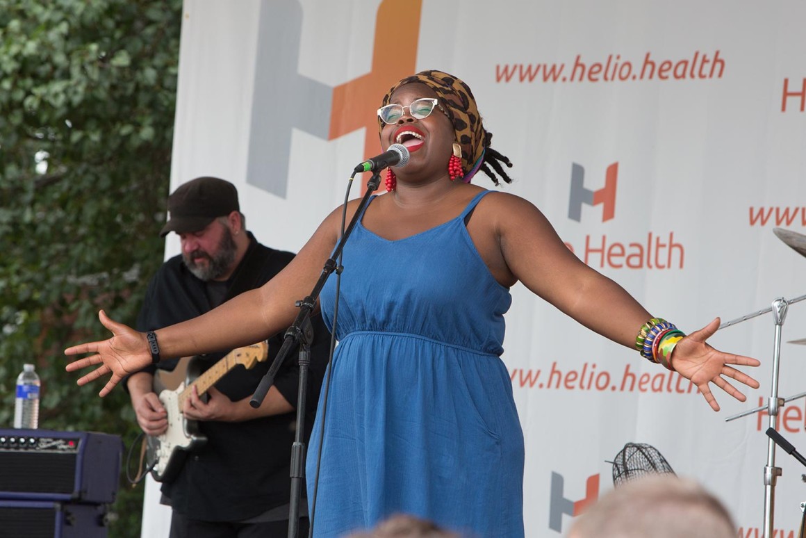 Danielle Ponder with arms open Helio Health Main Stage Corn Hill